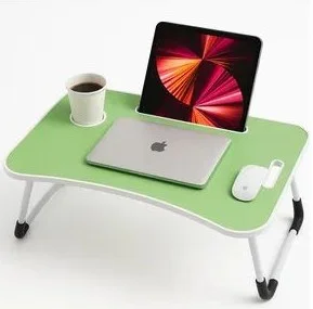 Light green portable lap desk with foldable white legs, featuring a closed laptop, tablet mounted in a built-in slot, a cup in a cup holder, and a wireless mouse.