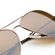 aviator-sunglasses-with-brown-lenses-on-white-back