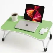 Light green portable lap desk with foldable white legs, featuring a closed laptop, tablet mounted in a built-in slot, a cup in a cup holder, and a wireless mouse.